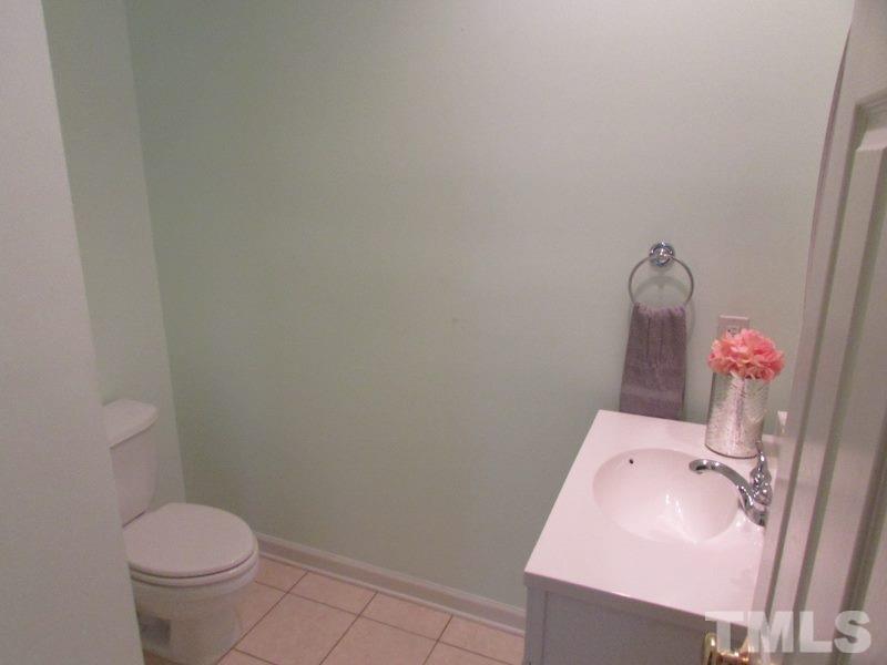 710 North Person Street, Unit 207 Raleigh, NC 27604 - Photo 7 of 12 a bathroom with a sink toilet and vanity