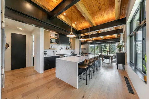 a view of kitchen with sink and wooden floor