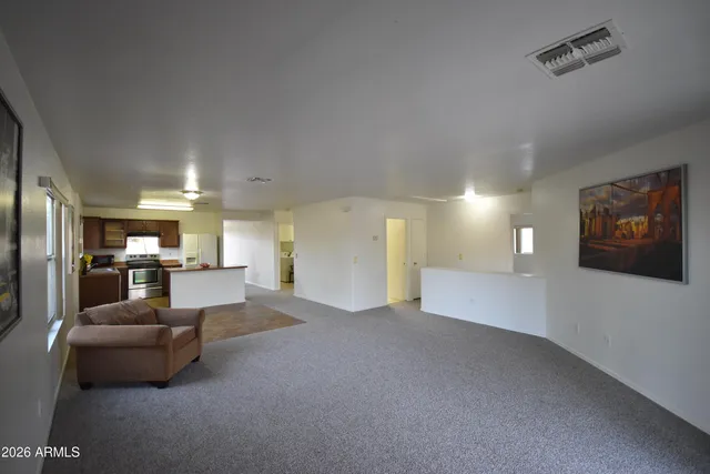 a view of a livingroom with furniture and a projector