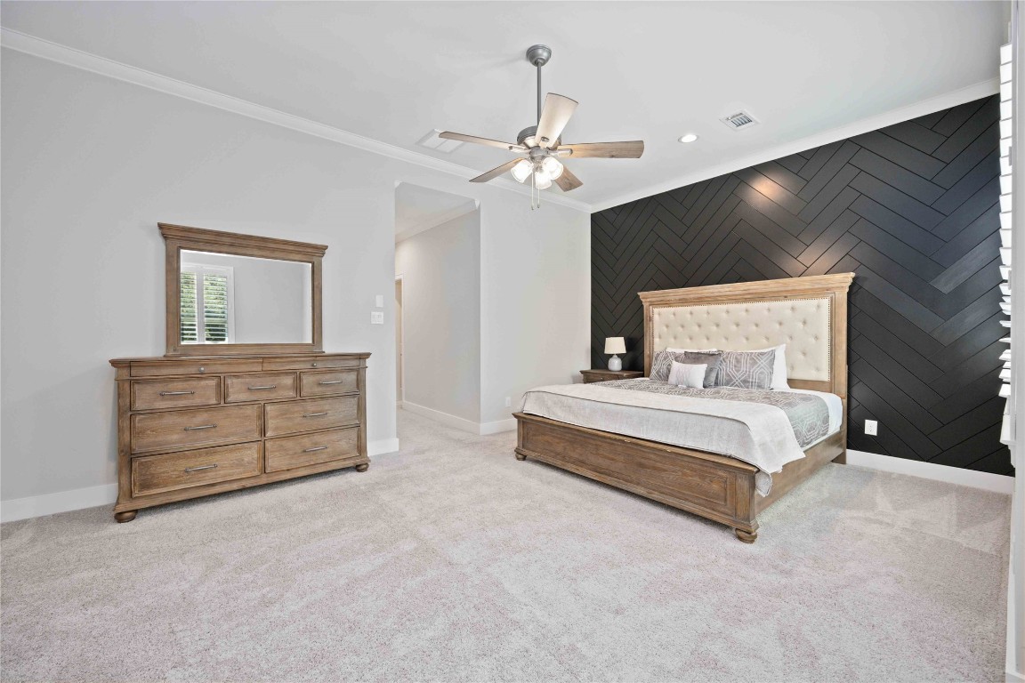 1324 West Pierce Street Houston, TX 77019 - Photo 15 of 26 a bedroom with a bed and a chandelier