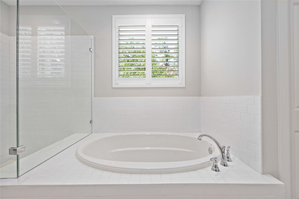 1324 West Pierce Street Houston, TX 77019 - Photo 18 of 26 a white bath tub sitting next to a window