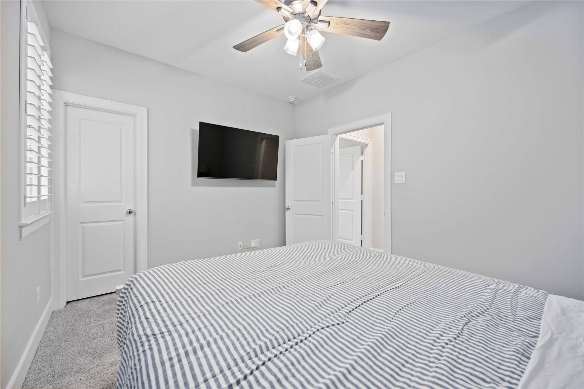 1324 West Pierce Street Houston, TX 77019 - Photo 23 of 26 a bedroom with a bed and a flat screen tv