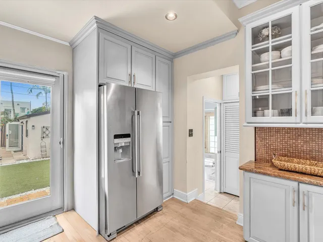 a kitchen with stainless steel appliances granite countertop a sink and cabinets