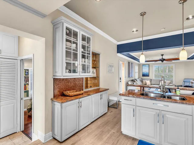 a close view of water heater room with washer and dryer