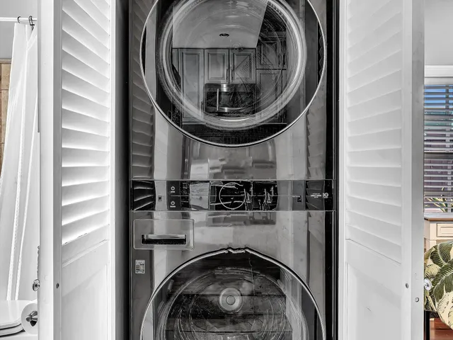 a bedroom with a bed and a large walk in closet