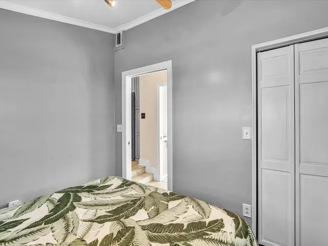 a bathroom with a granite countertop sink toilet and mirror