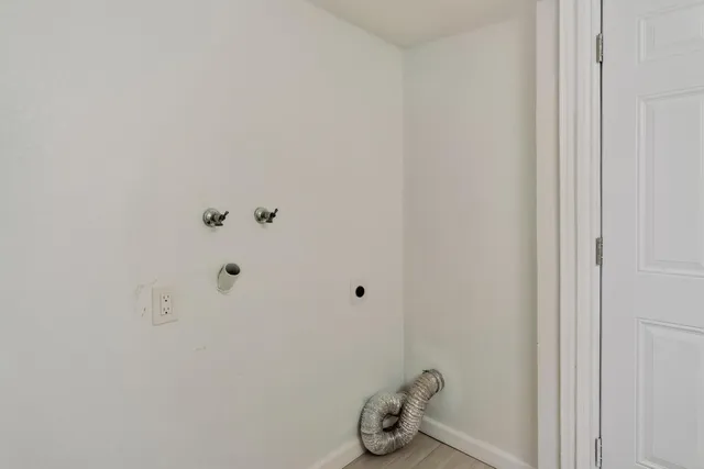 a bathroom with a sink and mirror with shower