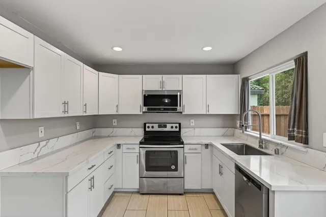a kitchen with a sink and a window