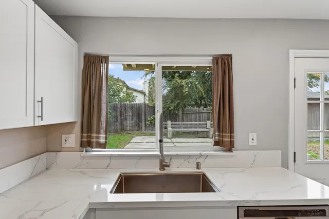 a kitchen with a sink and a window