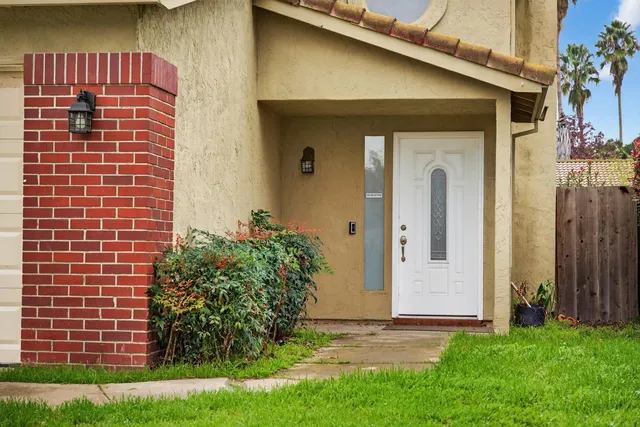 a front view of a house with garden