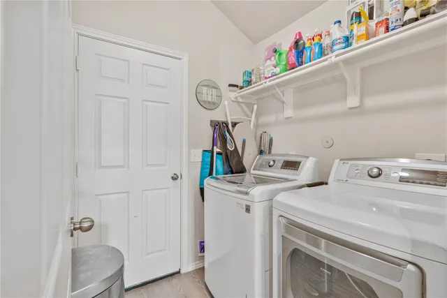 a utility room with dryer and washer