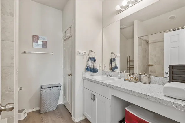 a bathroom with a double vanity sink and mirror