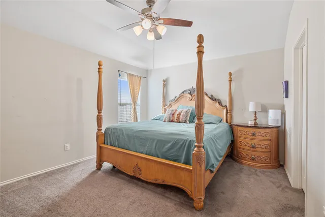 a bed room with a bed and a chandelier