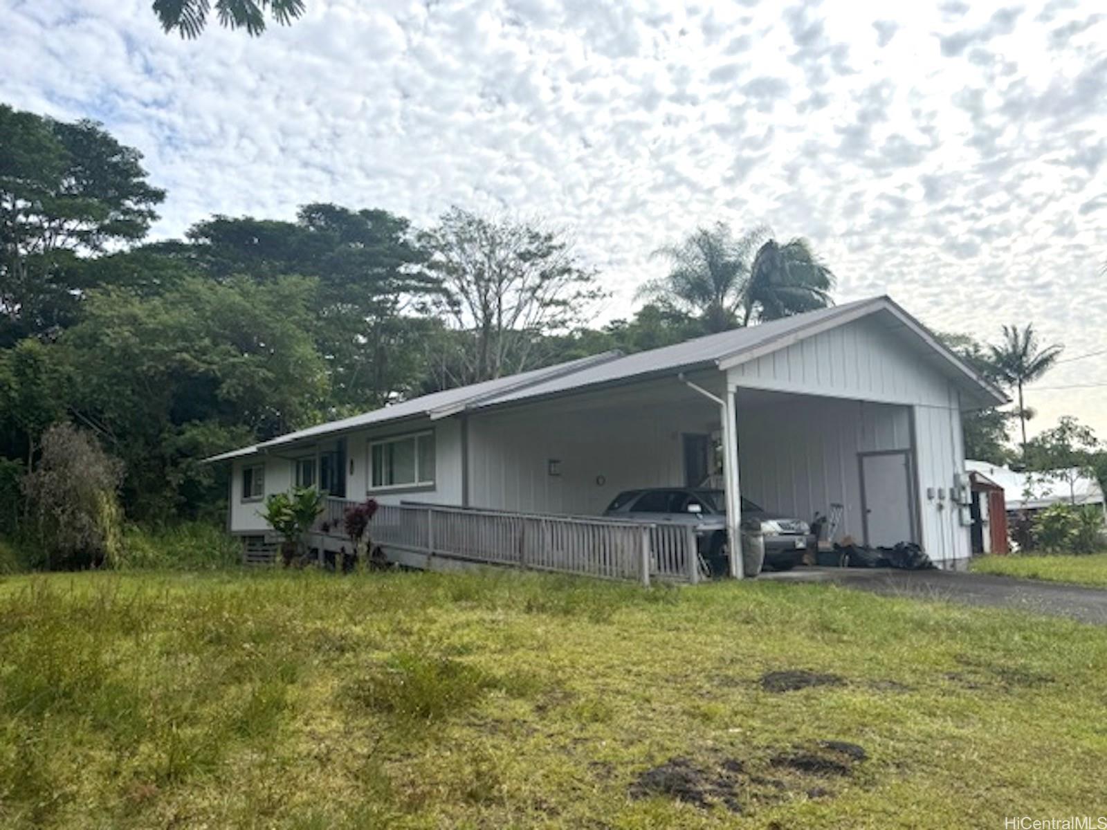 101 Kilua Road Hilo, HI 96720 - Photo 2 of 7 a front view of house with yard and seating area