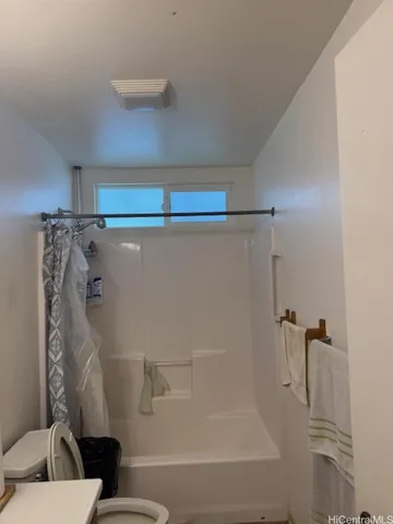 a bathroom with a tub and a shower