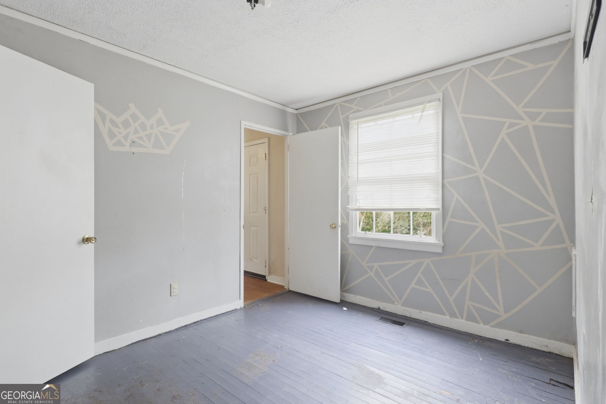 2413 Ruby Drive Augusta, GA 30906 - Photo 12 of 32 a view of an empty room with wooden floor and a window