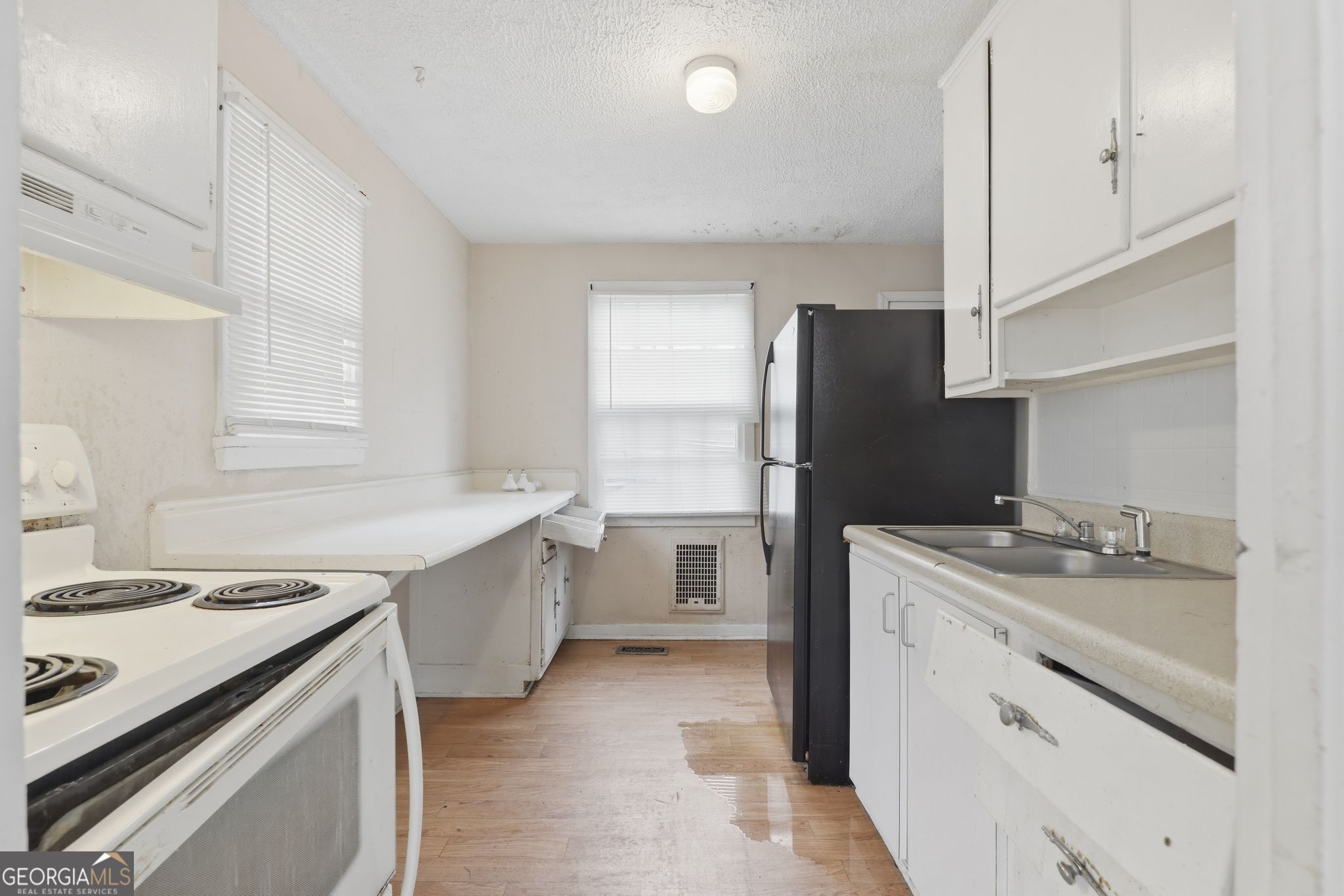 2413 Ruby Drive Augusta, GA 30906 - Photo 17 of 32 a kitchen with a sink stove and refrigerator