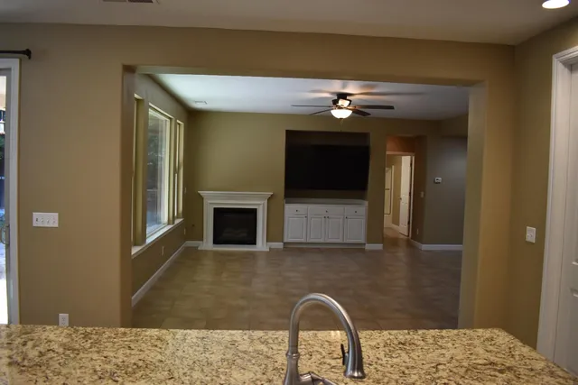 a bedroom with a bed and a fireplace