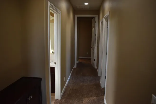 a view of a hallway with a closet