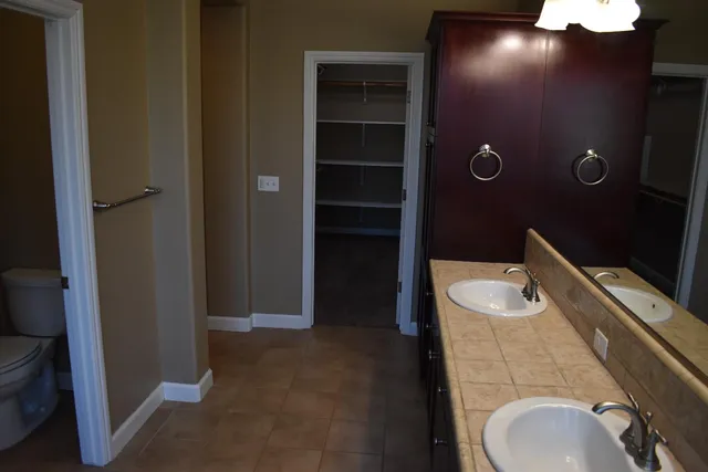 a bathroom with a sink and vanity