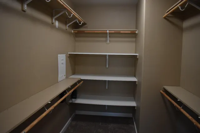 a view of room with racks on the wall