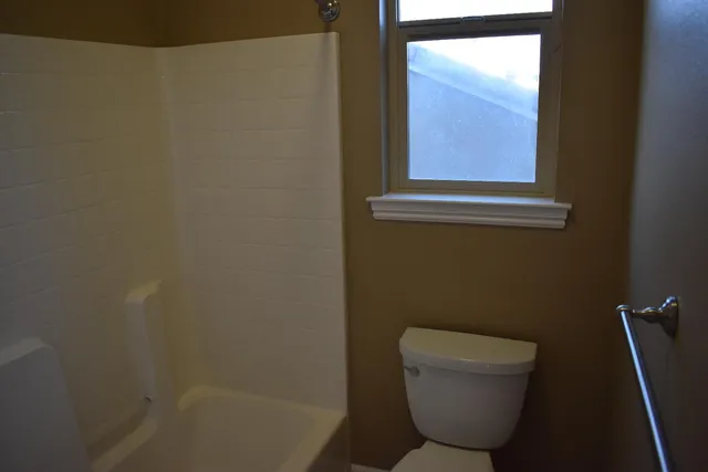 a bathroom with a toilet and a sink