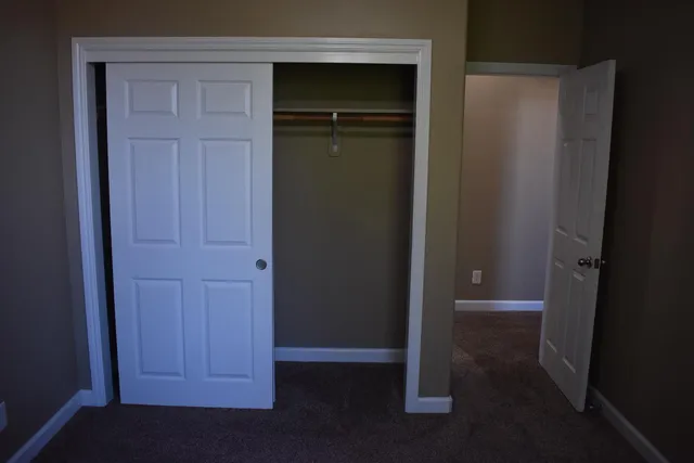 an empty room with closet door