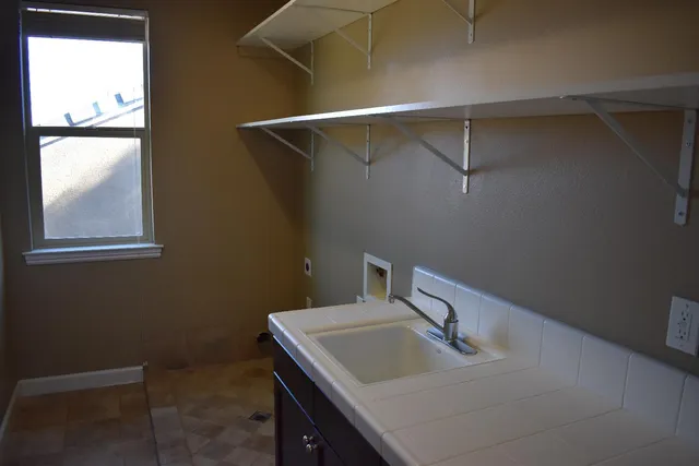 a bathroom with a sink and mirror
