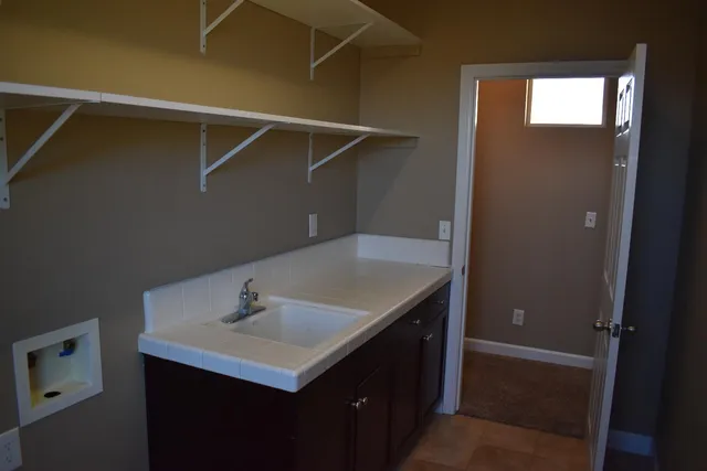a bathroom with a sink vanity and a mirror