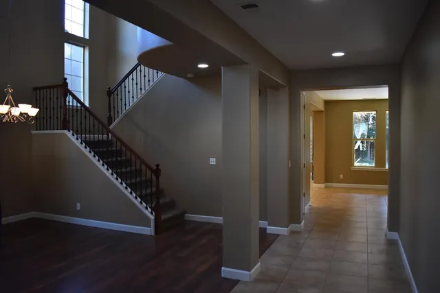 a view of entryway with stairs and wooden floor