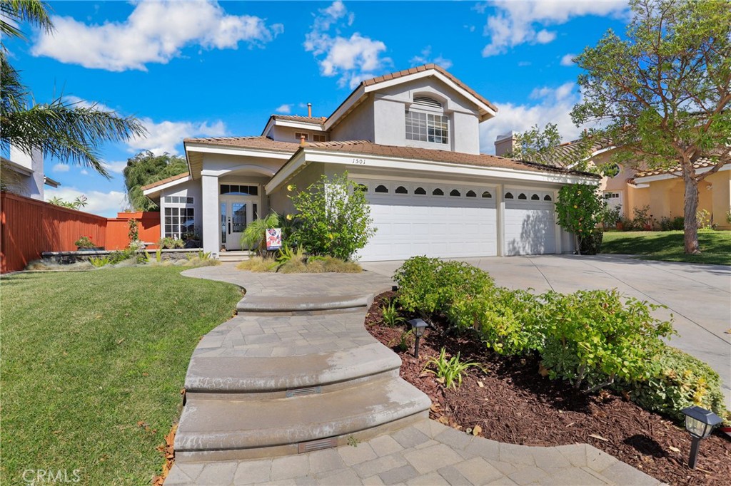 1501 Dominguez Ranch Road Corona, CA 92878 - Photo 1 of 1 front view of a house with a yard