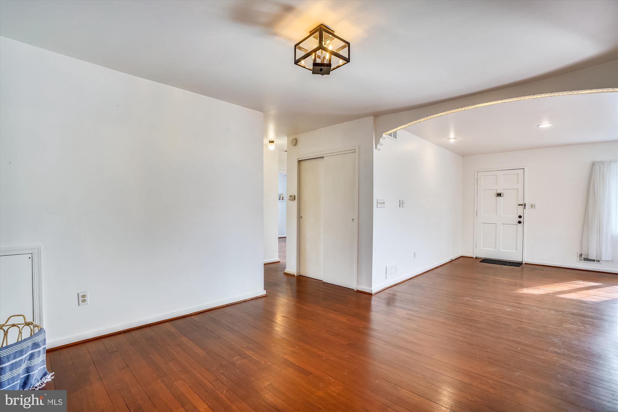 1010 Crosby Road Baltimore, MD 21228 - Photo 23 of 47 a view of an empty room with wooden floor