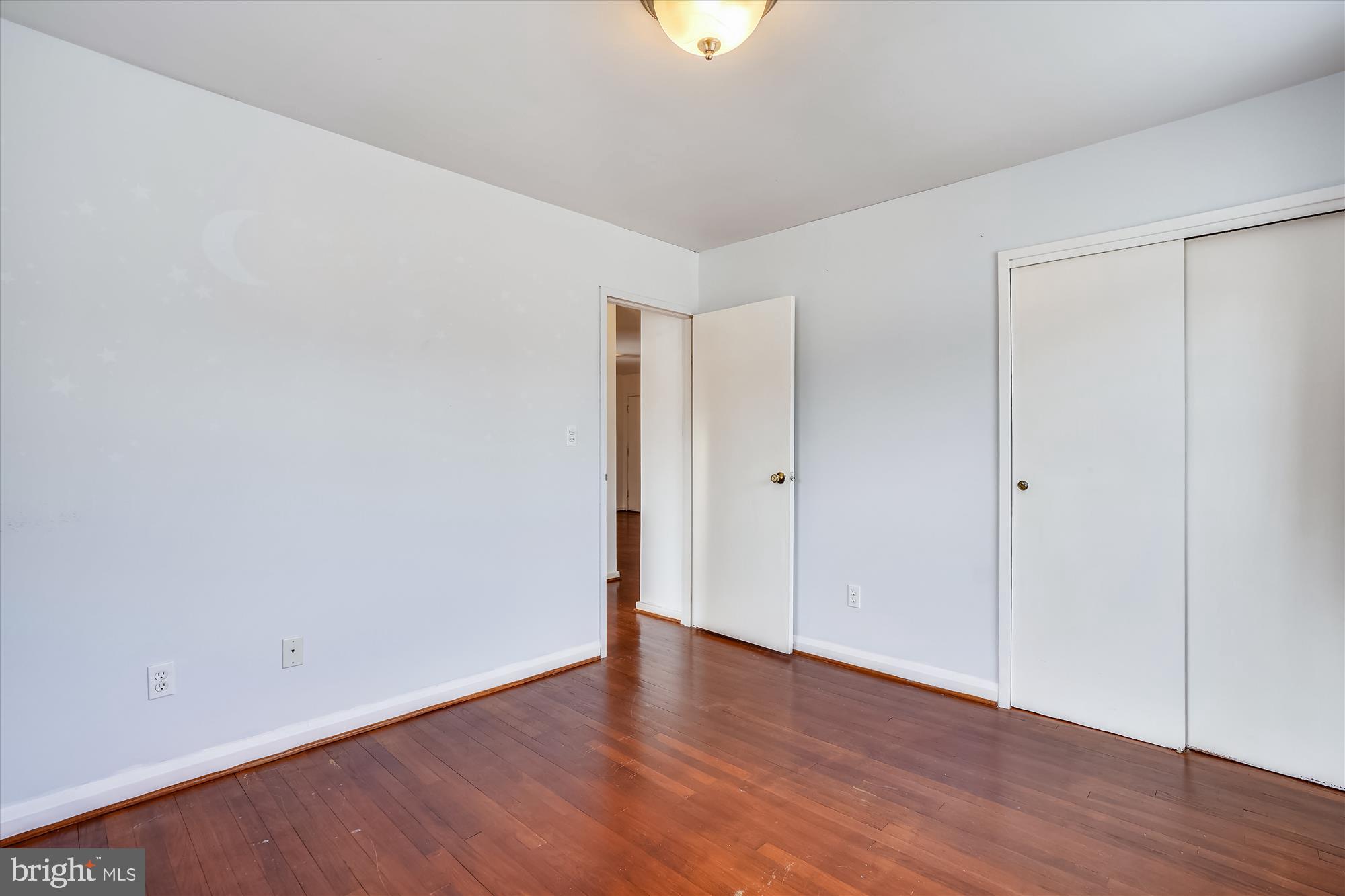 1010 Crosby Road Baltimore, MD 21228 - Photo 28 of 47 a view of an empty room with wooden floor