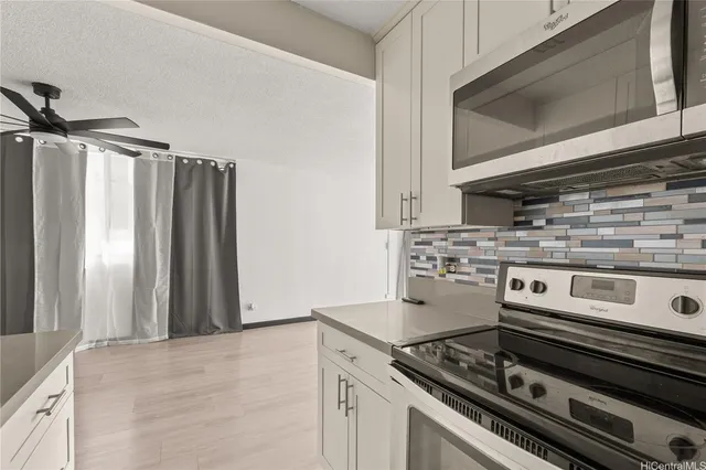 a kitchen with a stove and a microwave