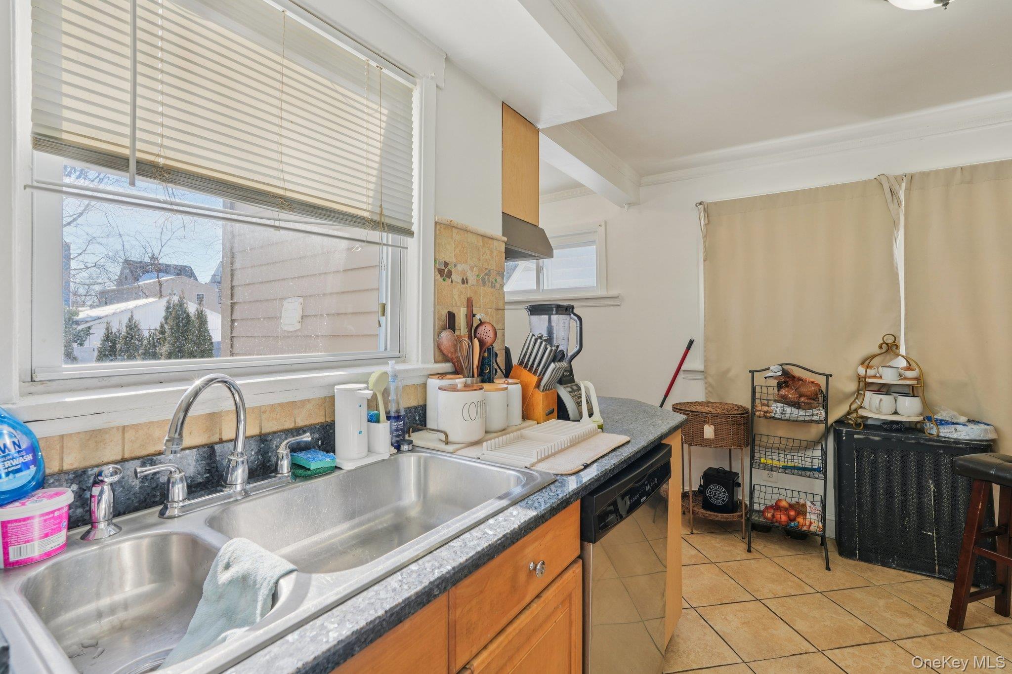 30 Ferdinand Place New Rochelle, NY 10801 - Photo 11 of 46 a kitchen with sink refrigerator and cabinets