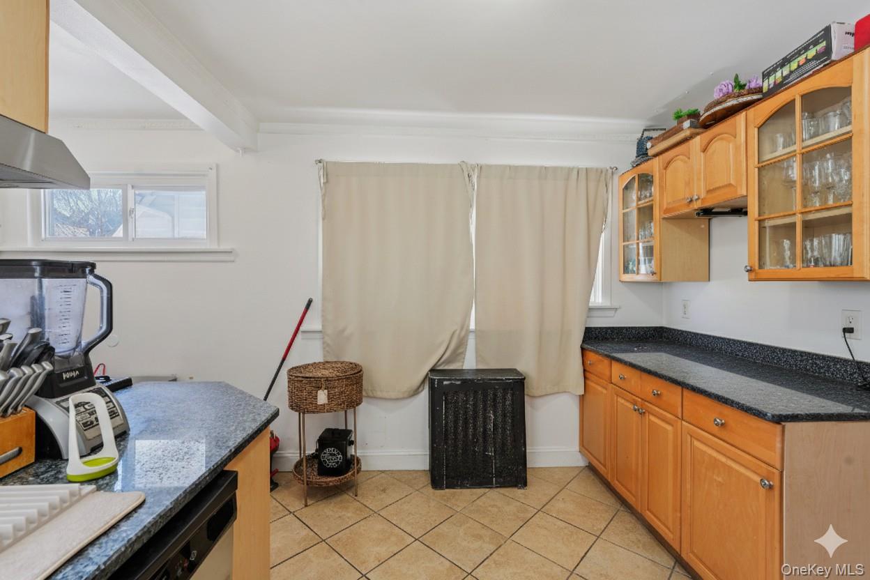 30 Ferdinand Place New Rochelle, NY 10801 - Photo 12 of 46 a kitchen with a sink and a stove top oven