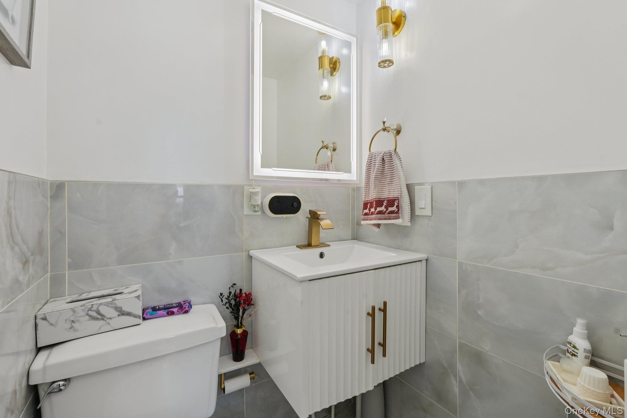 30 Ferdinand Place New Rochelle, NY 10801 - Photo 13 of 46 a bathroom with a sink toilet and a mirror
