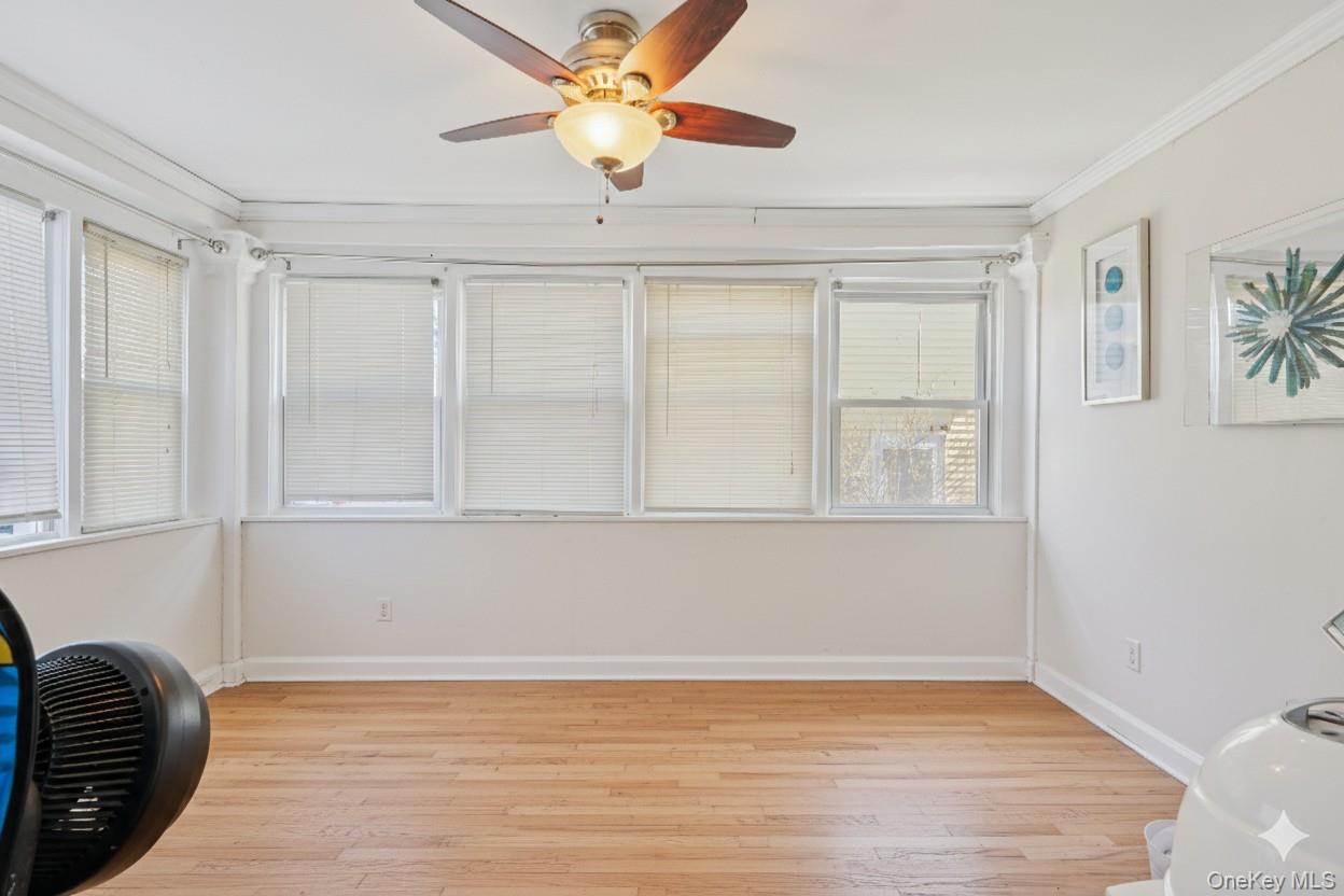 30 Ferdinand Place New Rochelle, NY 10801 - Photo 14 of 46 a view of an empty room with window and wooden floor