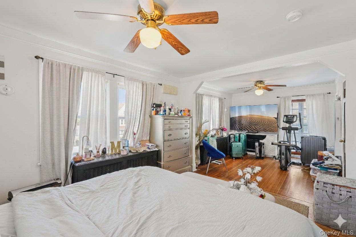 30 Ferdinand Place New Rochelle, NY 10801 - Photo 16 of 46 a bedroom with a bed and a chandelier