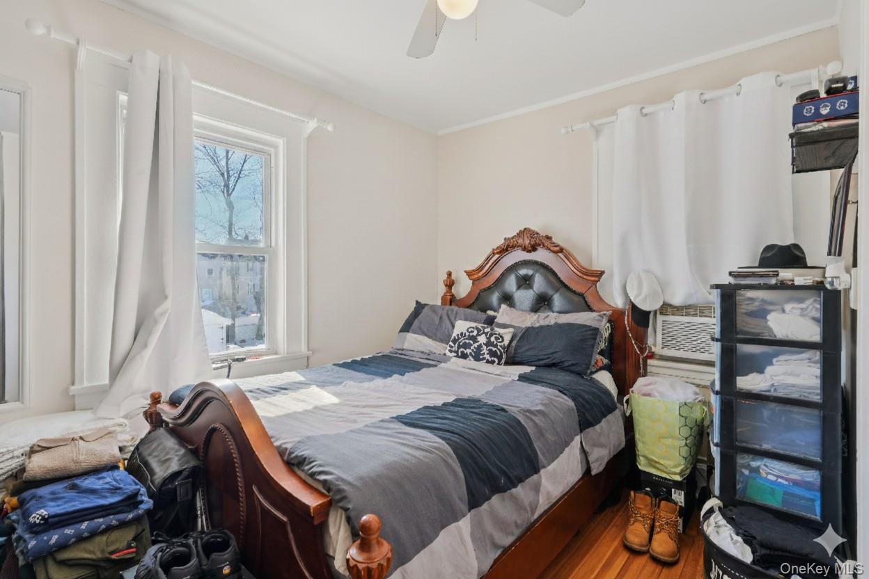 30 Ferdinand Place New Rochelle, NY 10801 - Photo 18 of 46 a bedroom with a bed and a window