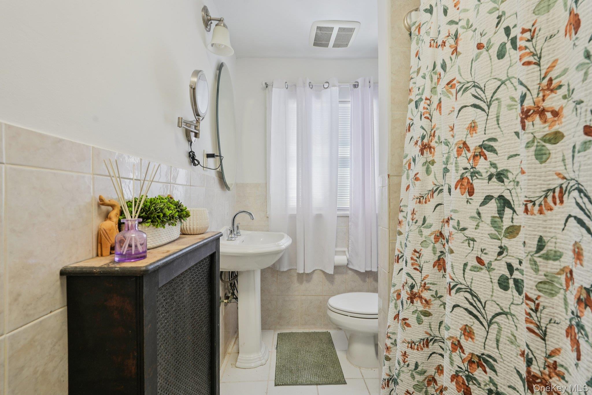 30 Ferdinand Place New Rochelle, NY 10801 - Photo 20 of 46 a bathroom with a sink toilet and shower