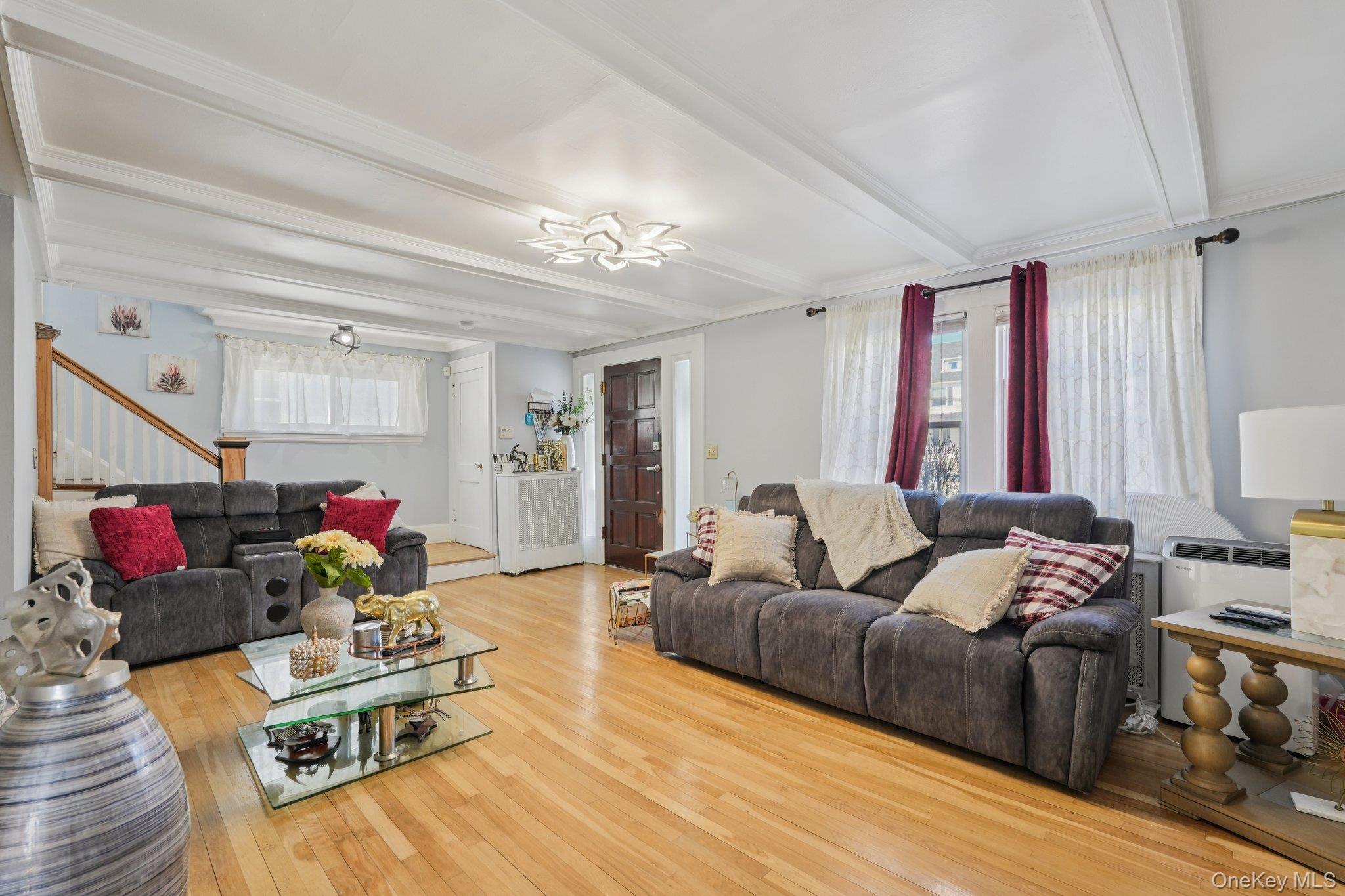 30 Ferdinand Place New Rochelle, NY 10801 - Photo 2 of 46 a living room with furniture and a chandelier