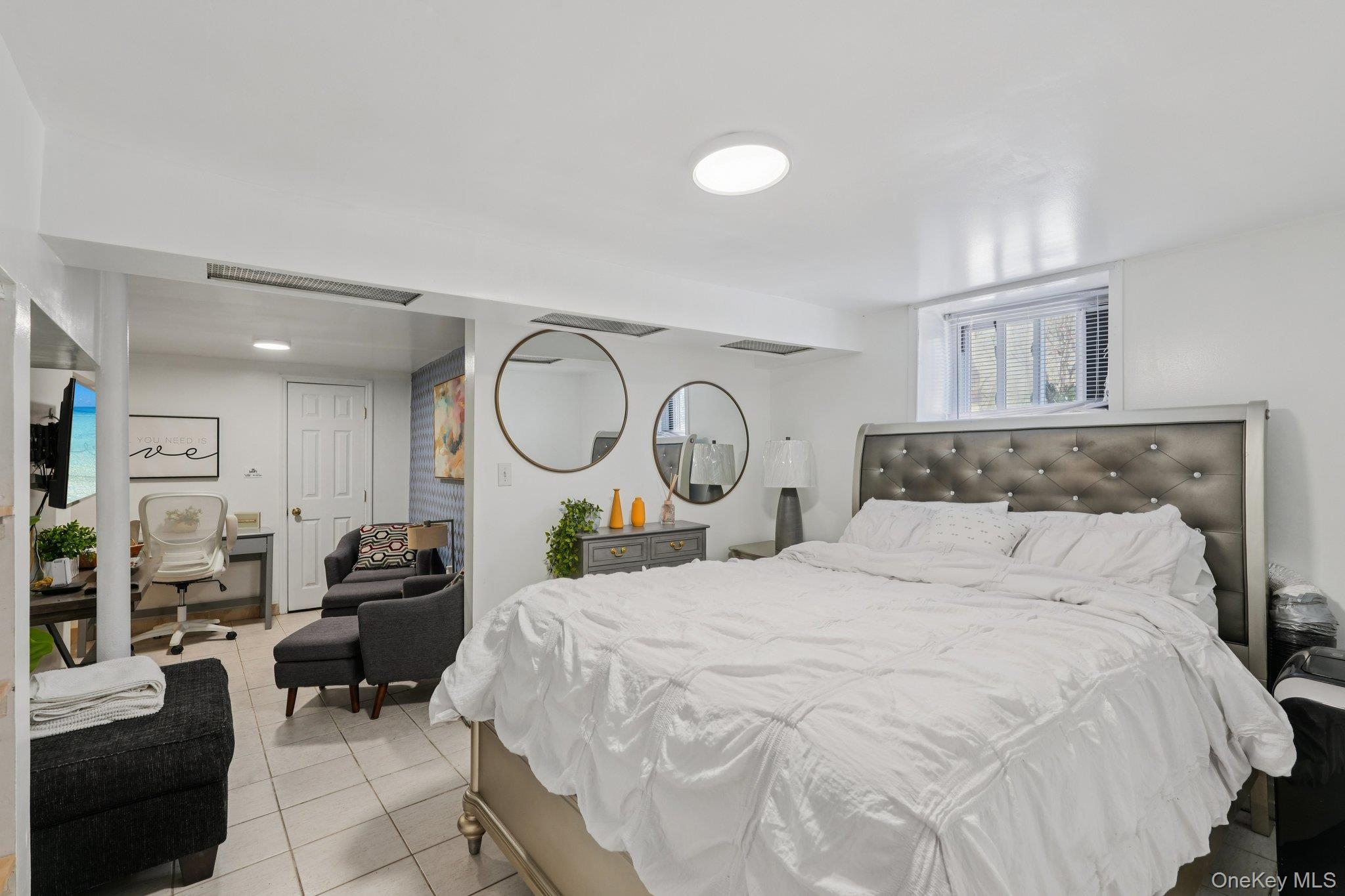 30 Ferdinand Place New Rochelle, NY 10801 - Photo 26 of 46 a bedroom with bed and a mirror