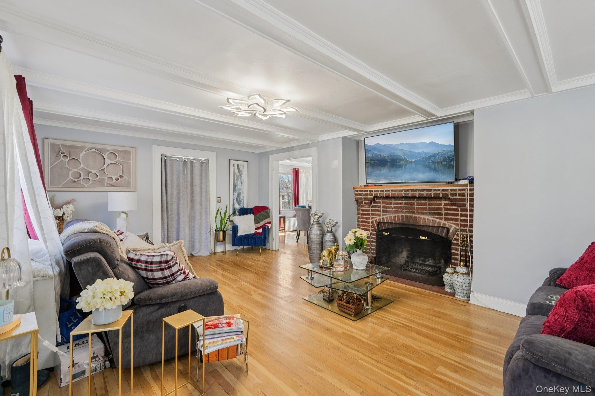 30 Ferdinand Place New Rochelle, NY 10801 - Photo 3 of 46 a living room with furniture and a fireplace