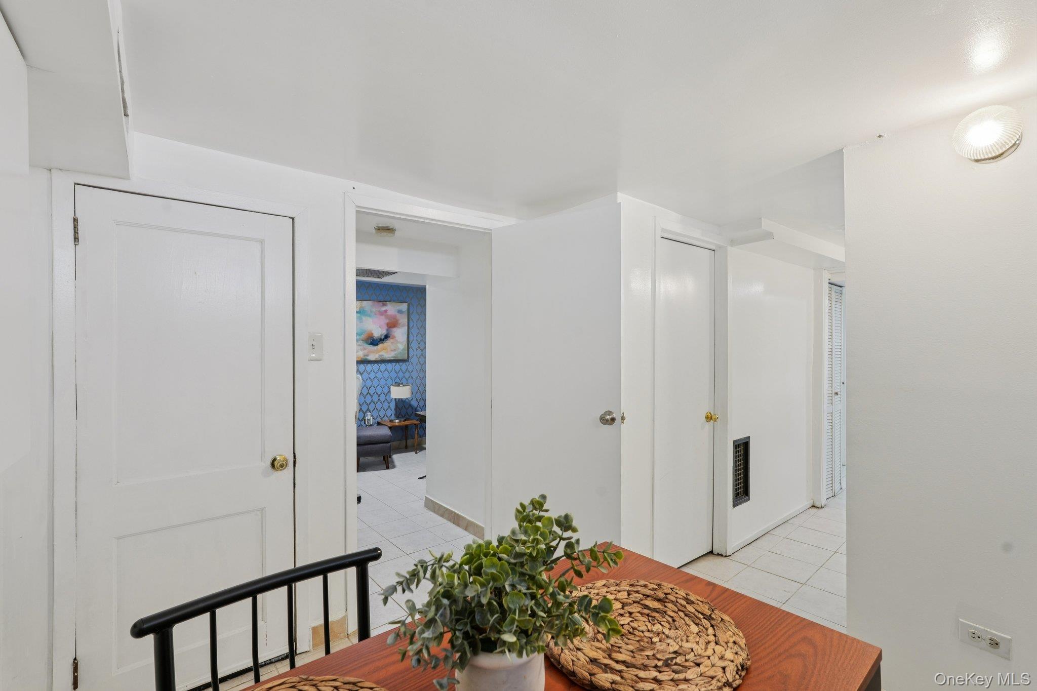 30 Ferdinand Place New Rochelle, NY 10801 - Photo 32 of 46 a view of a hallway with wooden floor and a bathroom