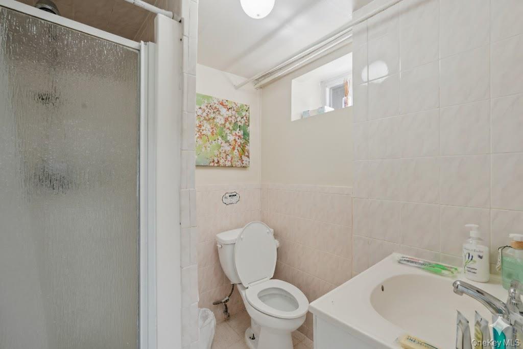 30 Ferdinand Place New Rochelle, NY 10801 - Photo 34 of 46 a white toilet sitting next to a white tub