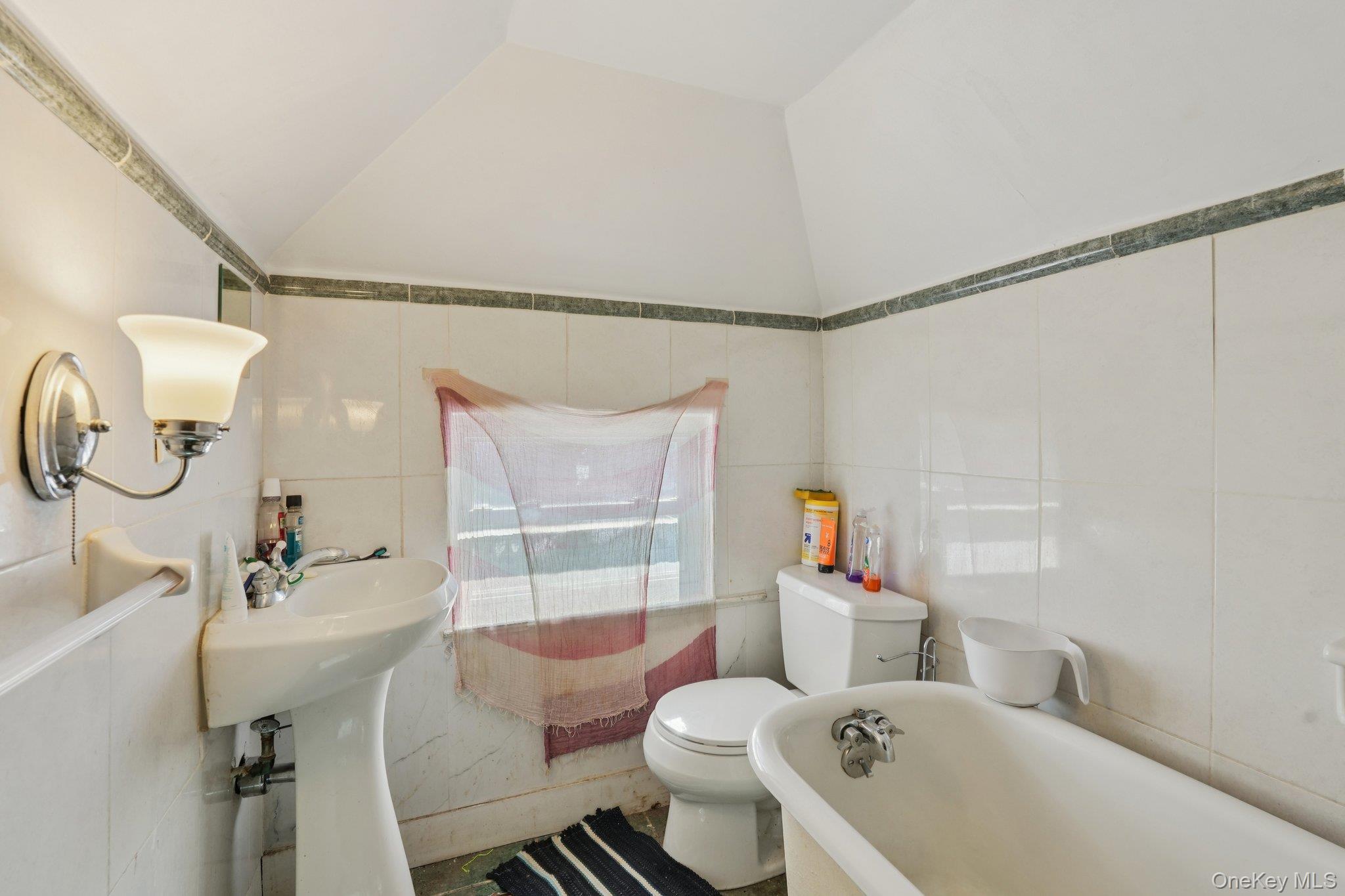 30 Ferdinand Place New Rochelle, NY 10801 - Photo 35 of 46 a bathroom with a sink mirror vanity and toilet