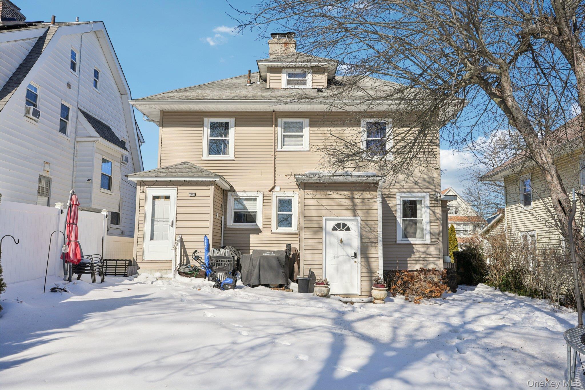 30 Ferdinand Place New Rochelle, NY 10801 - Photo 39 of 46 a front view of a house with a yard