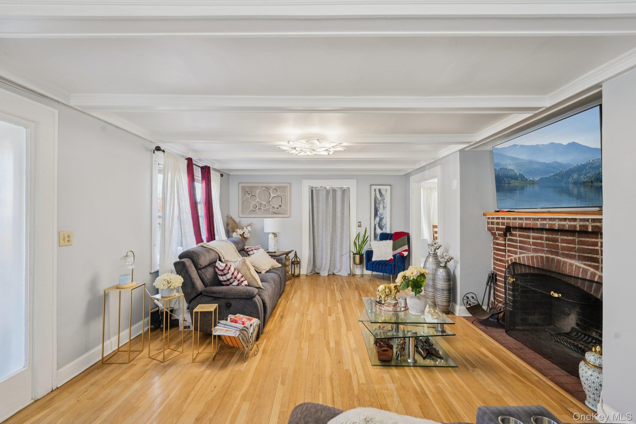 30 Ferdinand Place New Rochelle, NY 10801 - Photo 4 of 46 a living room with furniture and a fireplace