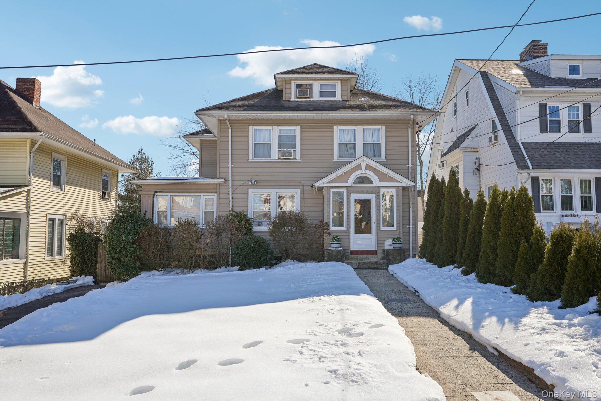 30 Ferdinand Place New Rochelle, NY 10801 - Photo 41 of 46 a front view of a house with a yard